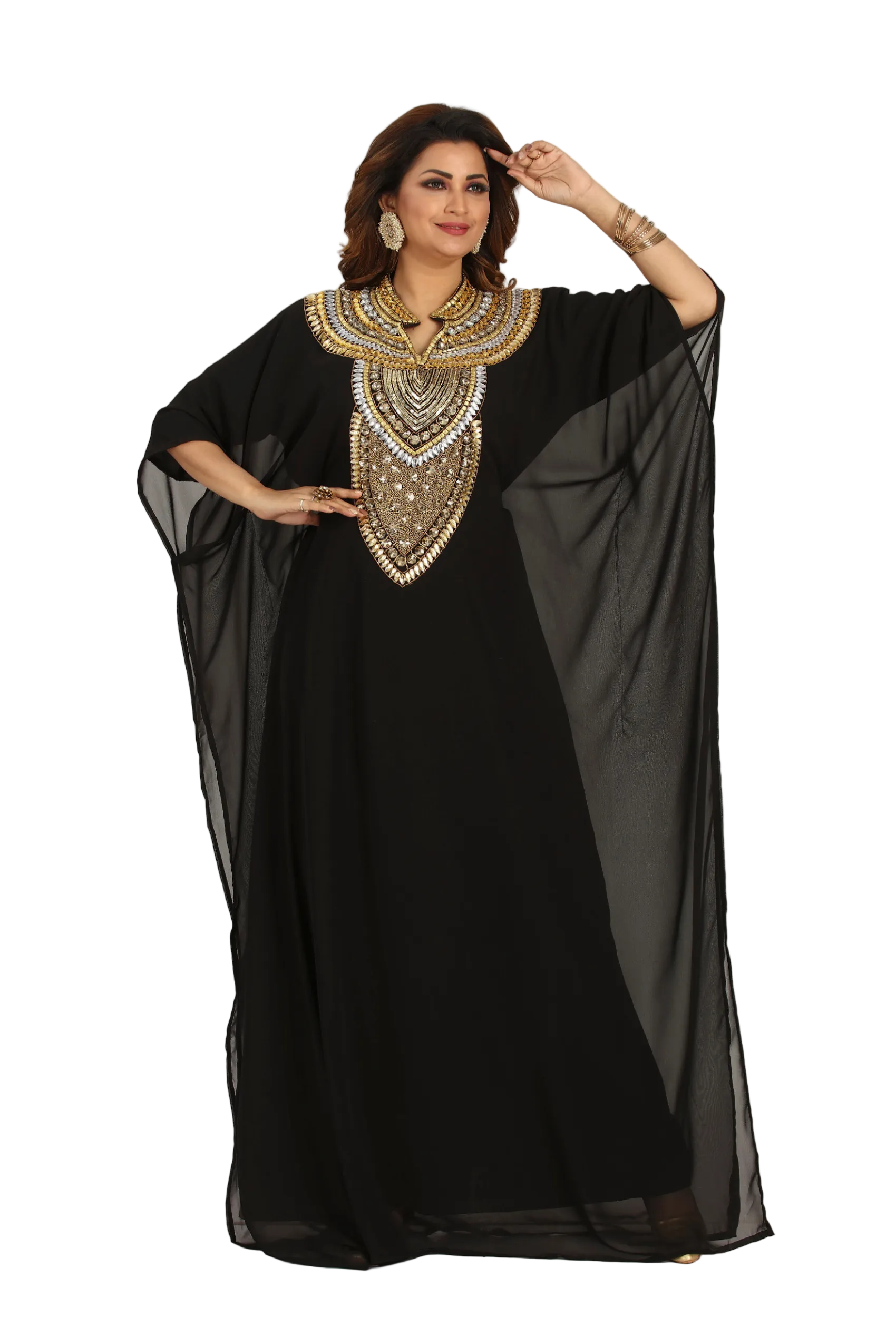 Woman wearing a black dress with gold embroidery on a white background