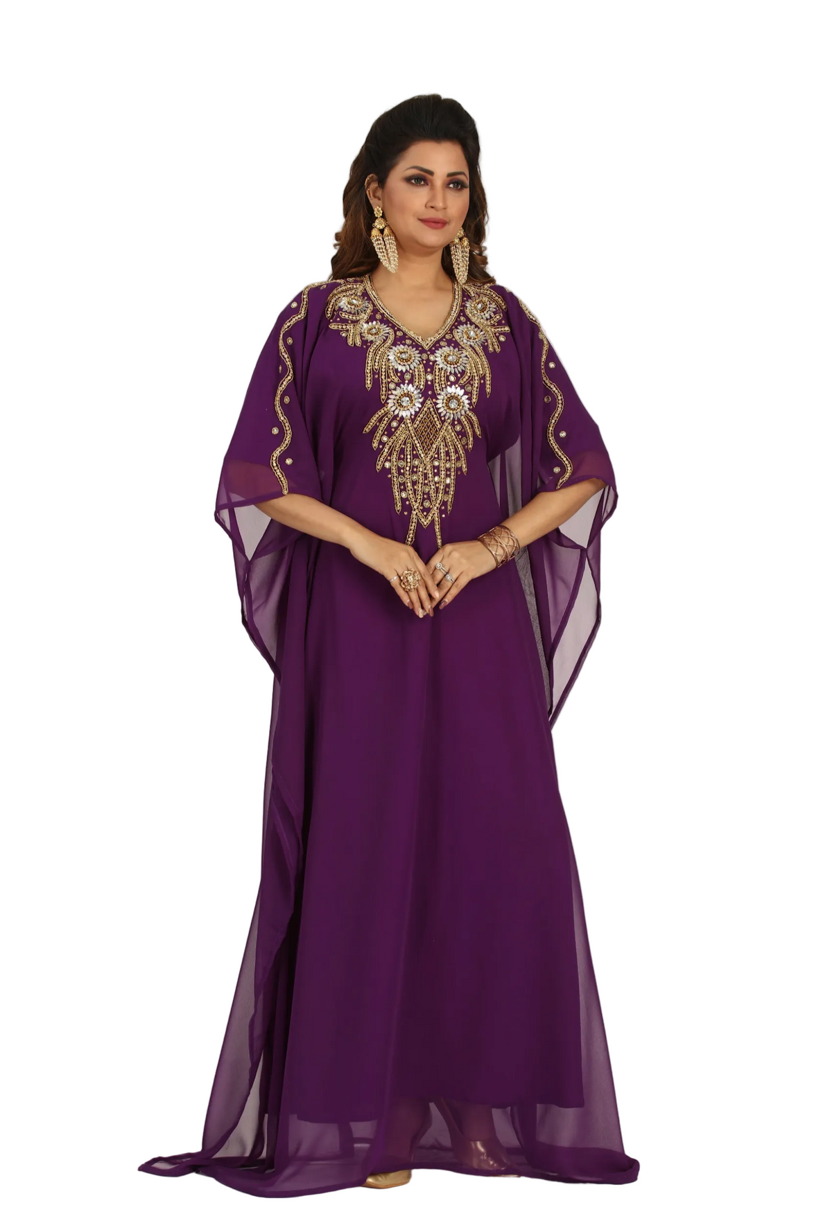 Woman wearing a purple dress with gold embroidery on a white background