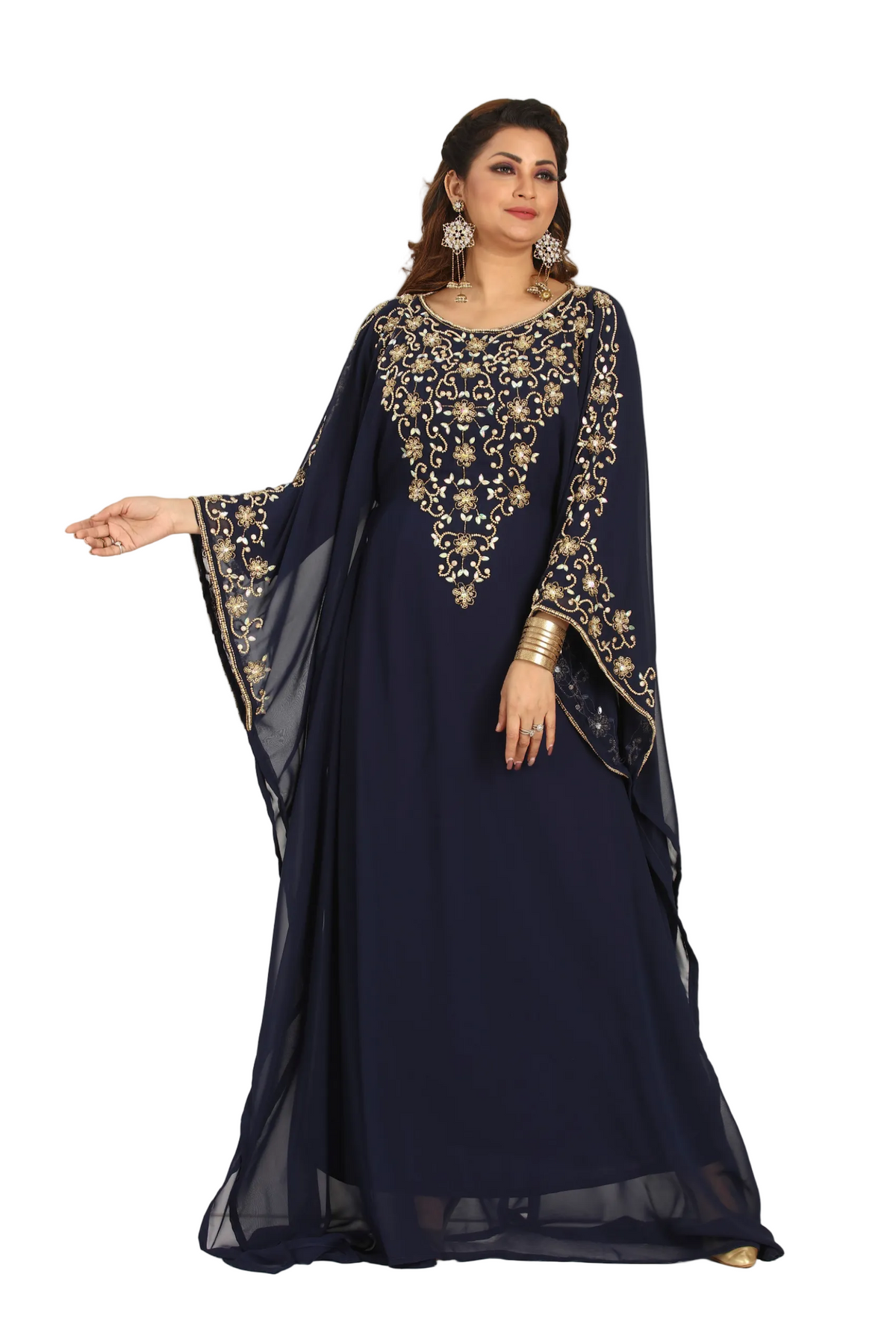 Woman wearing a navy blue dress with gold embroidery on a white background
